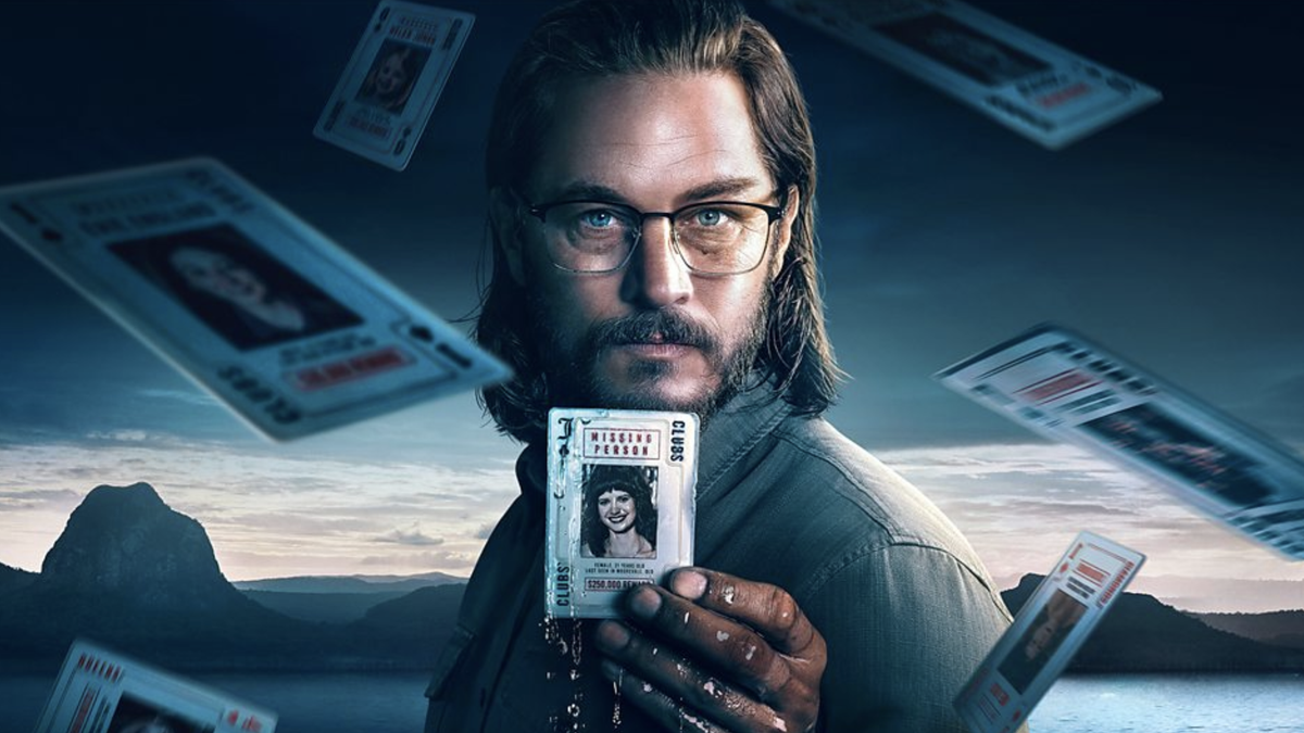 Detective James Cormack (Travis Fimmel) holds up a playing card in Aussie crime drama TV show Black Snow season 2 (2025)