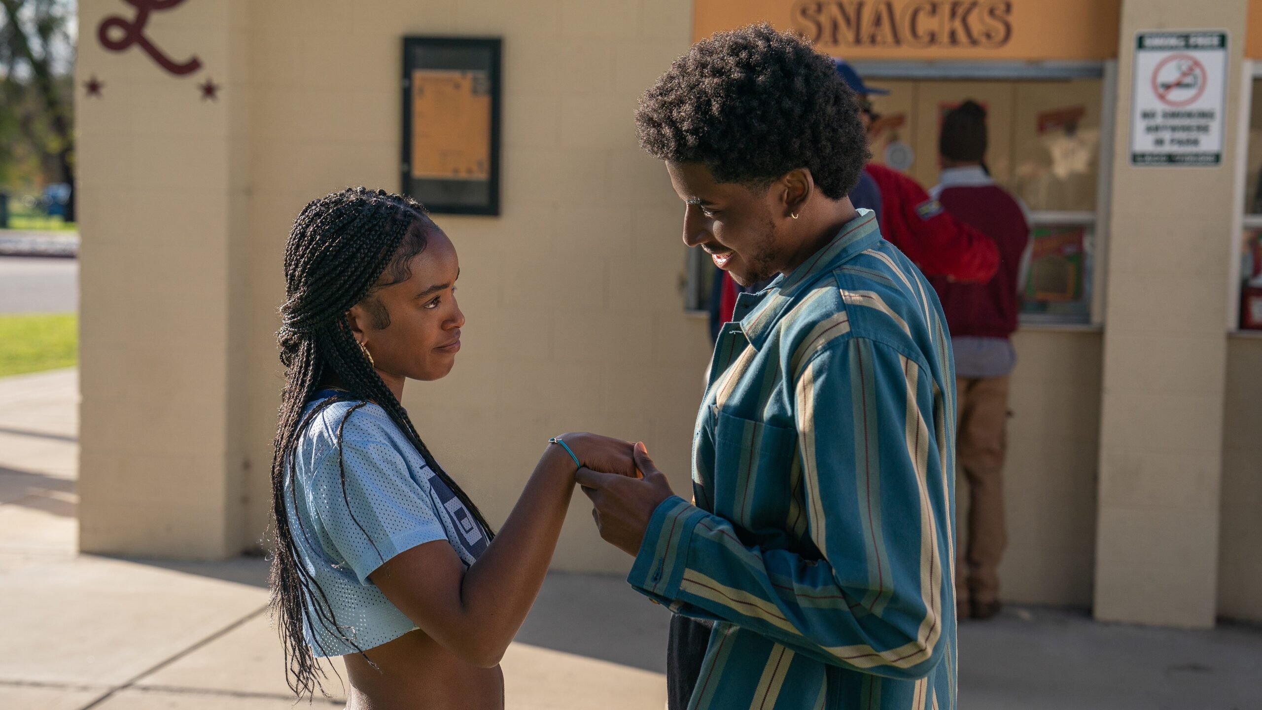 Keisha (Lovie Simone) and Justin (Michael Cooper Jr.) hold hands in a scene from Netflix's "Forever"
