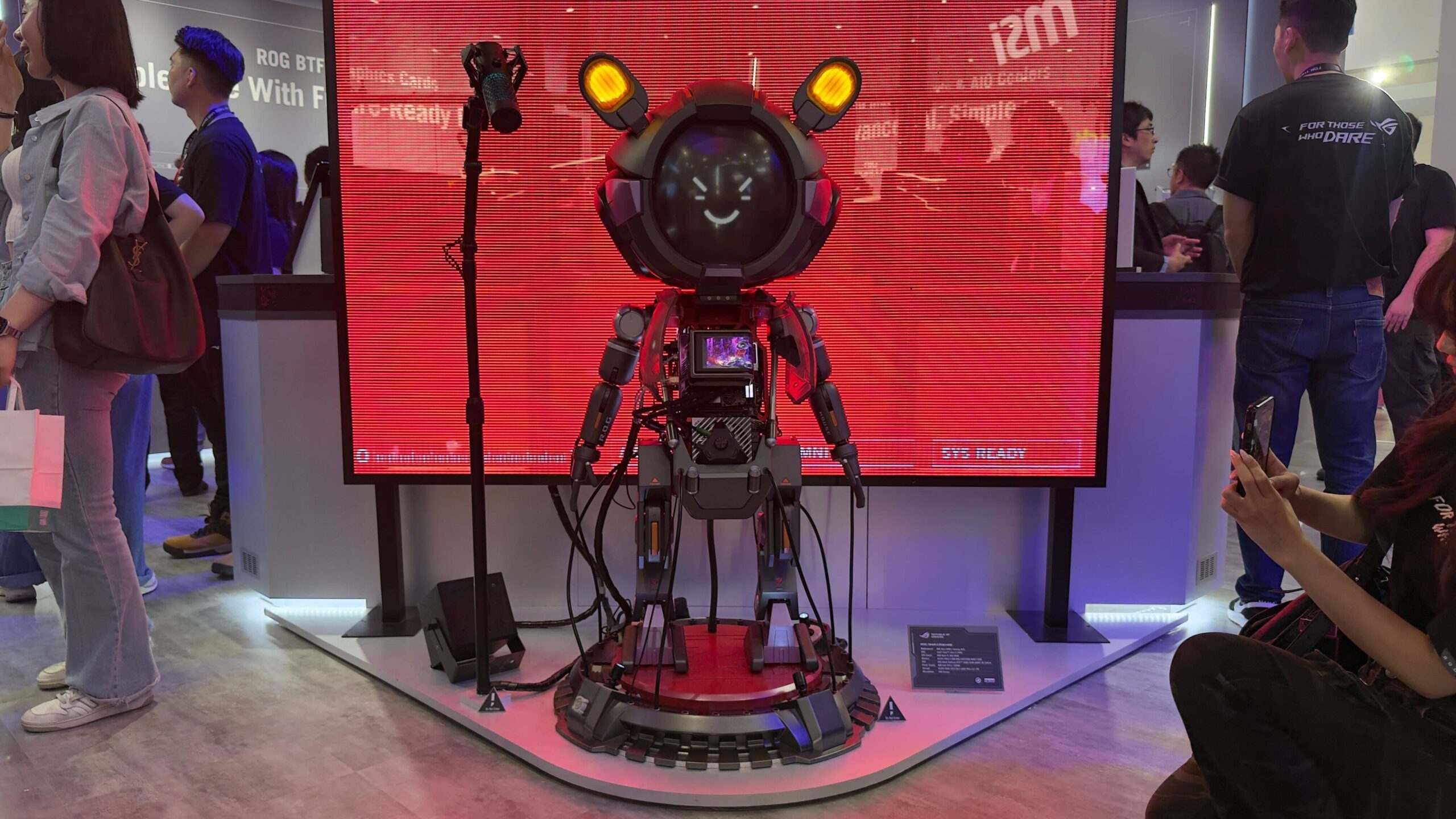 Asus ROG Robot PC with people beside it on Computex 2025 showfloor