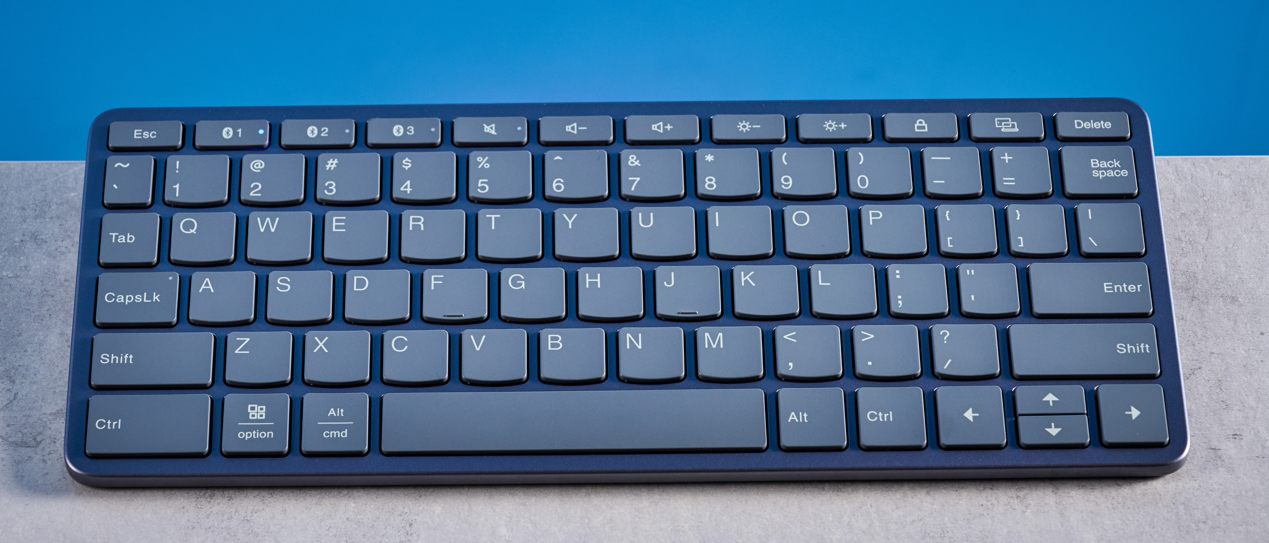 Lenovo Multi Device Keyboard photographed in front of a blue background.
