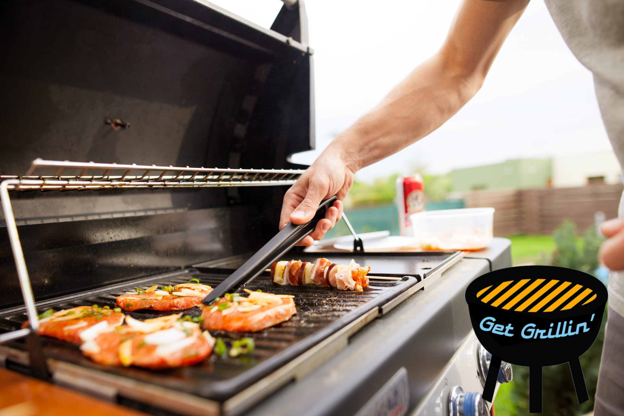 A man grilling food on an outdoor grill