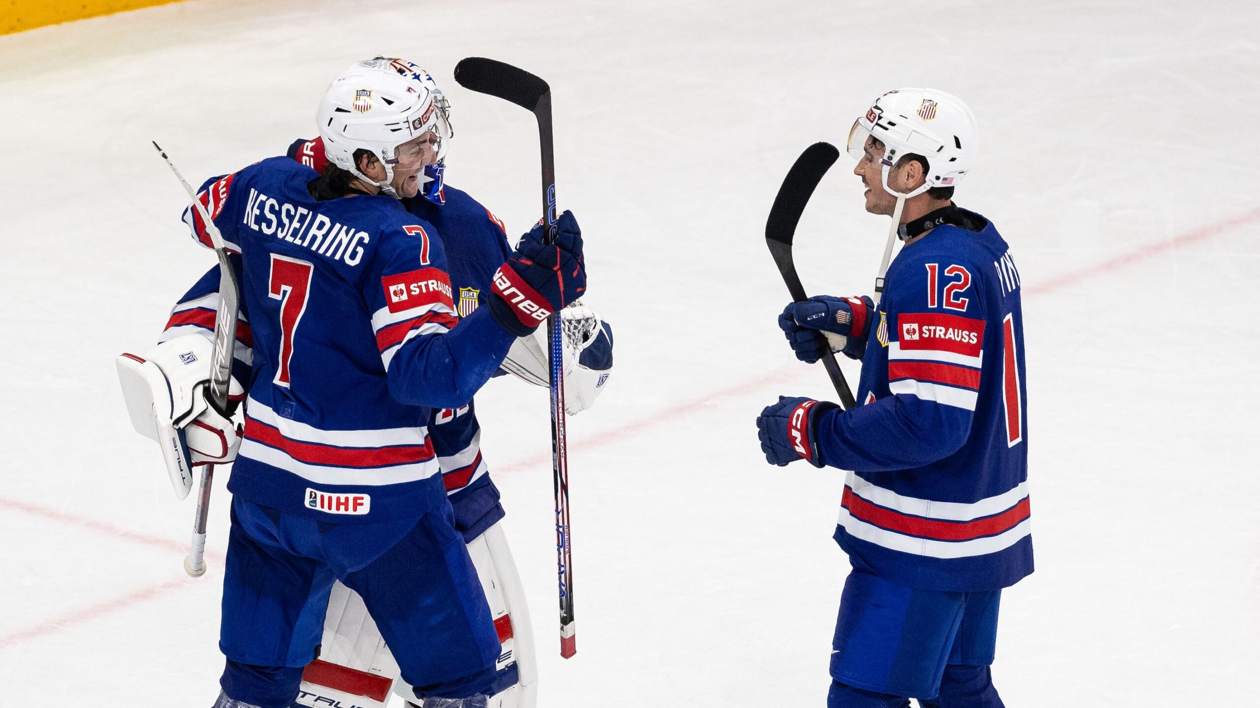STOCKHOLM, SWEDEN - MAY 24: Jeremy Swayman, Michael Kesselring, and Shane Pinto of USA celebrate after the 2025 Ice Hockey World Championship match between Sweden and USA at Avicii Arena on May 24, 2025 in Stockholm, Sweden. (Photo by Michael Campanella/Getty Images)