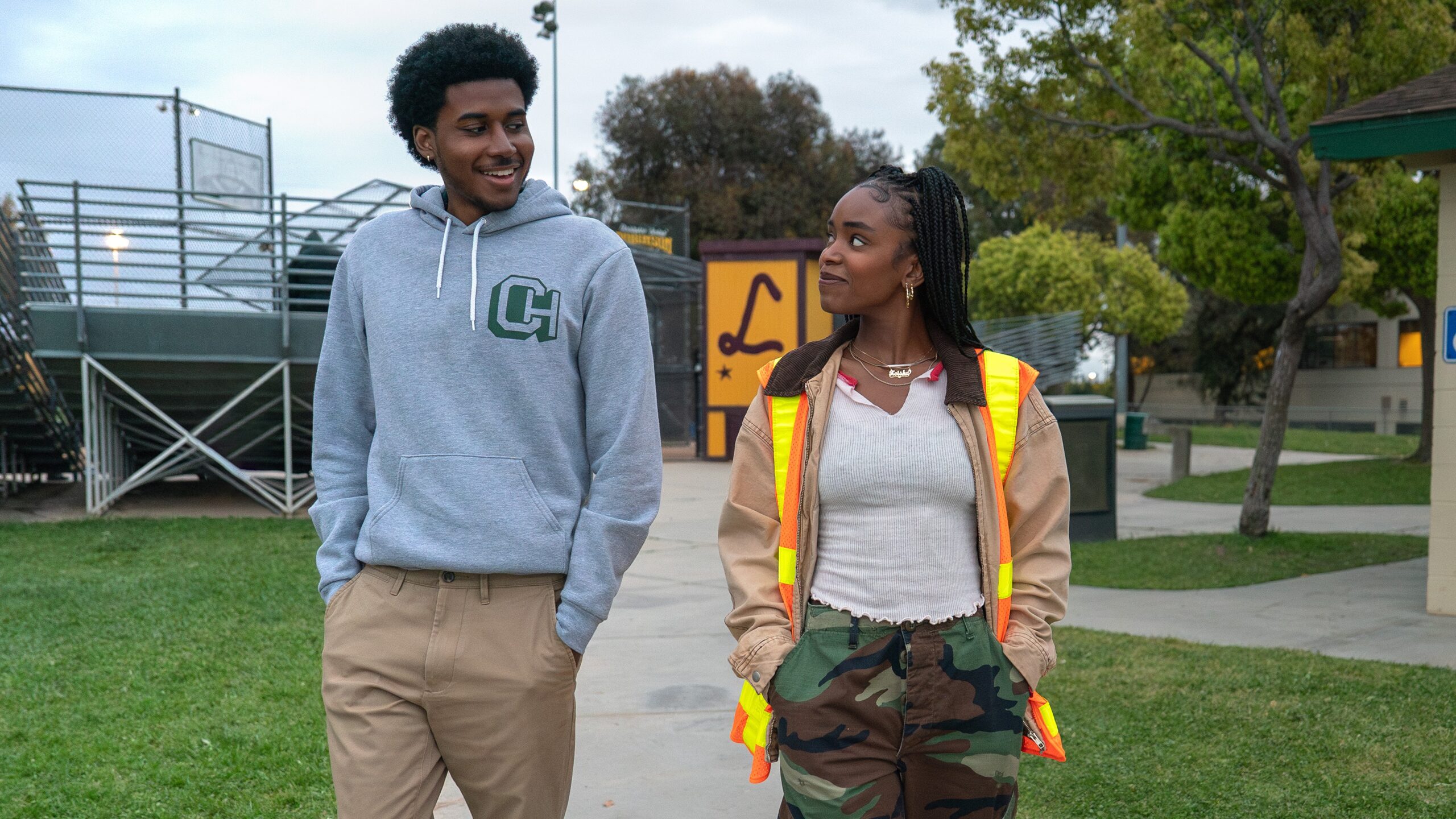 L-R: Justin (Michael Cooper Jr.) and Keisha (Lovie Simone) walking together in a scene from Netflix's "Forever"
