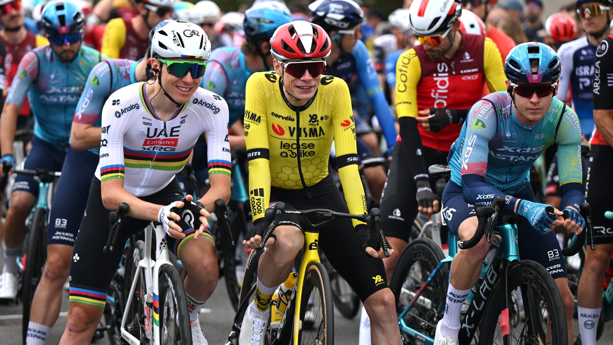 Jonas Vingegaard and Tadej Pogacar speaking before the start of the 2025 Criterium du Dauphine