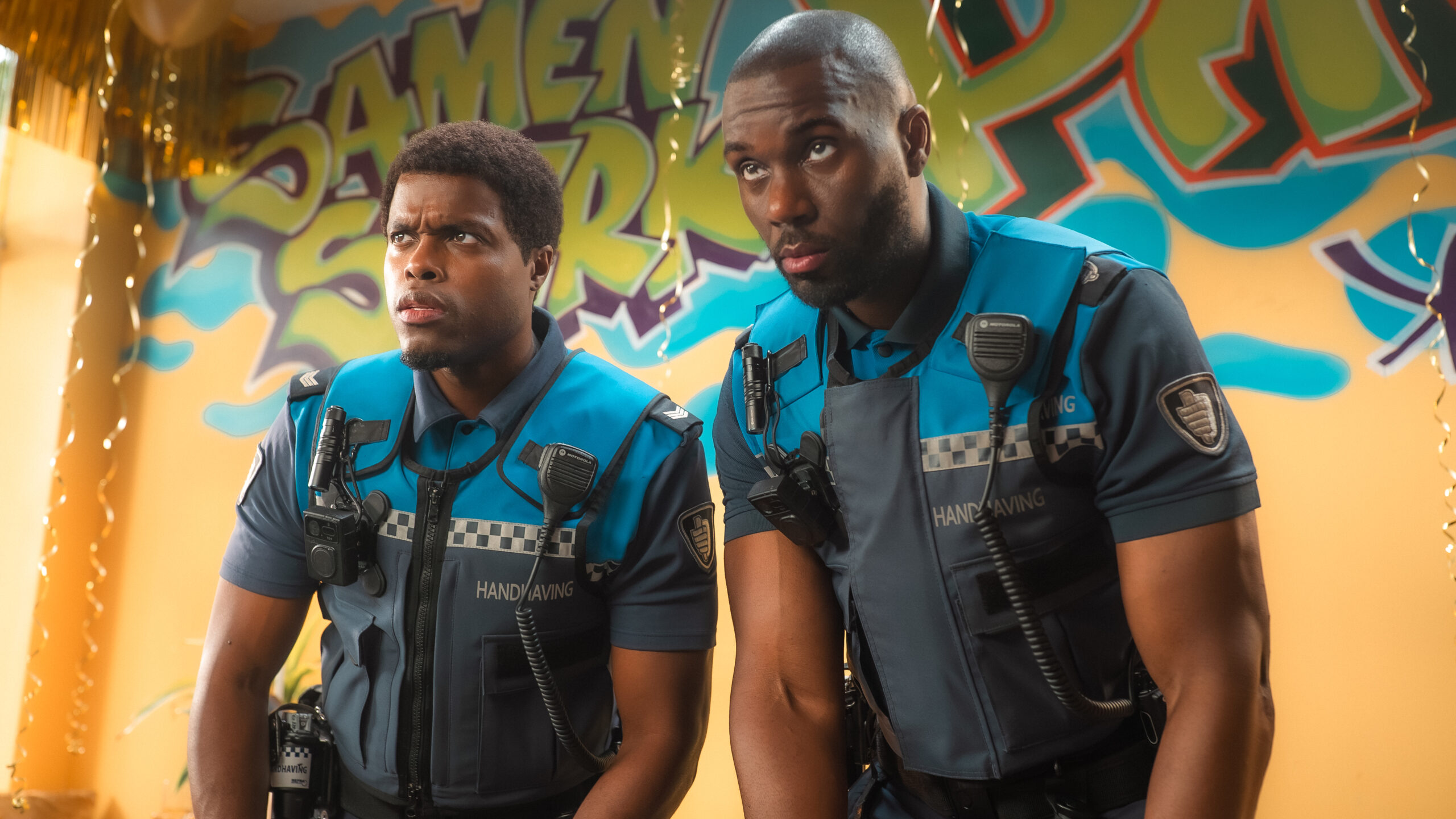 L-R: Ramon (Jandino Asporaat) and Jack (Werner Kolf) in uniform in a scene from Netflix's "Almost Cops"