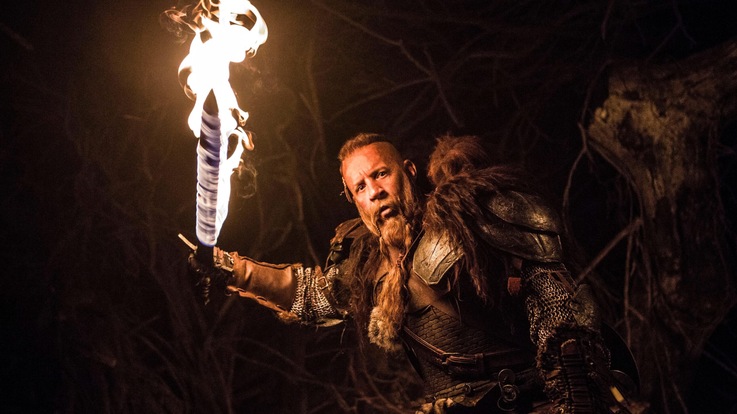 Kaulder (Vin Diesel) in medieval wear and wielding a flaming sword in a scene from "The Last Witch Hunter"