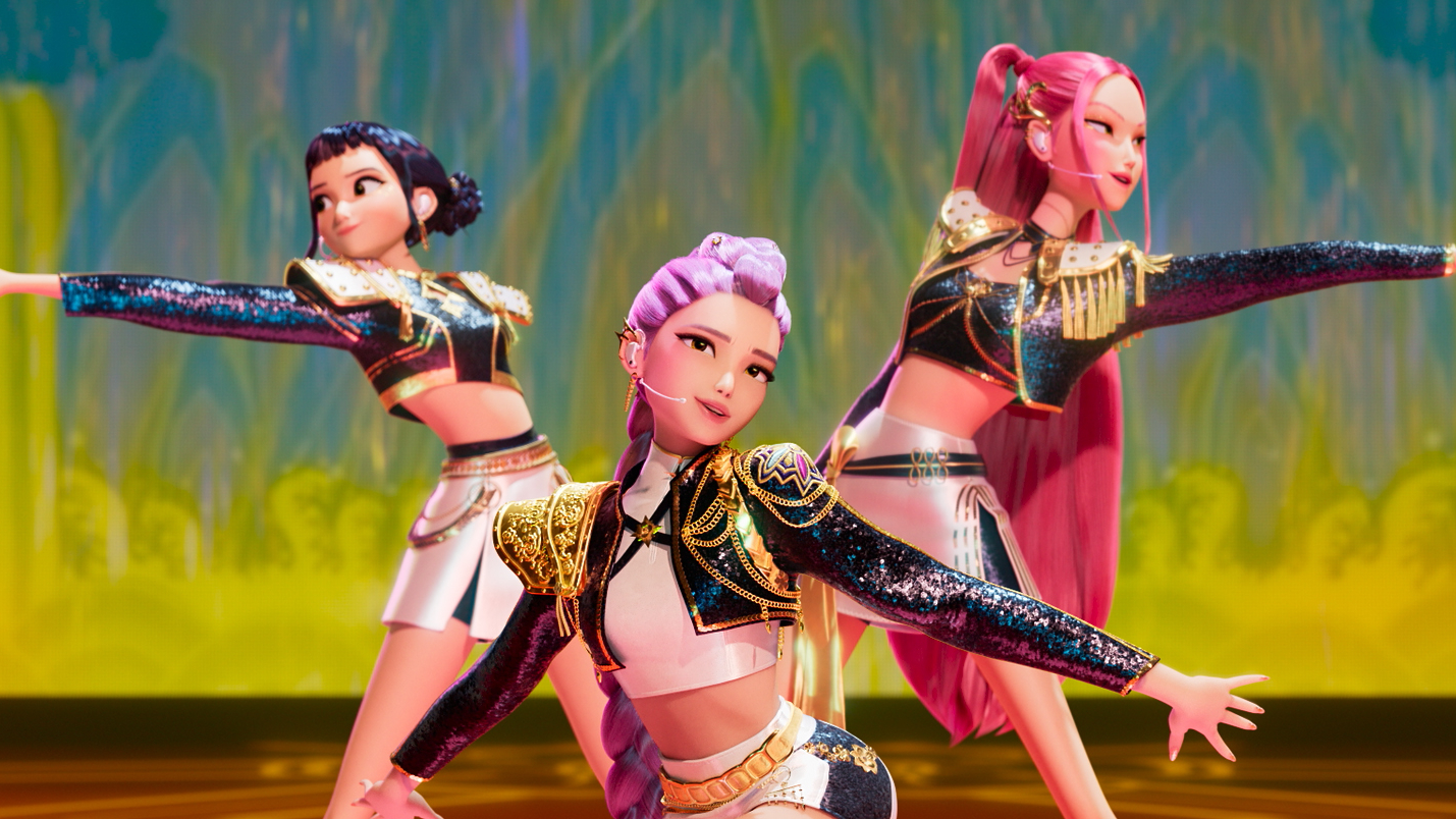 L-R: Zoey, Rumi (front) and Mira pose on-stage in a scene from Netflix's "KPop Demon Hunters"
