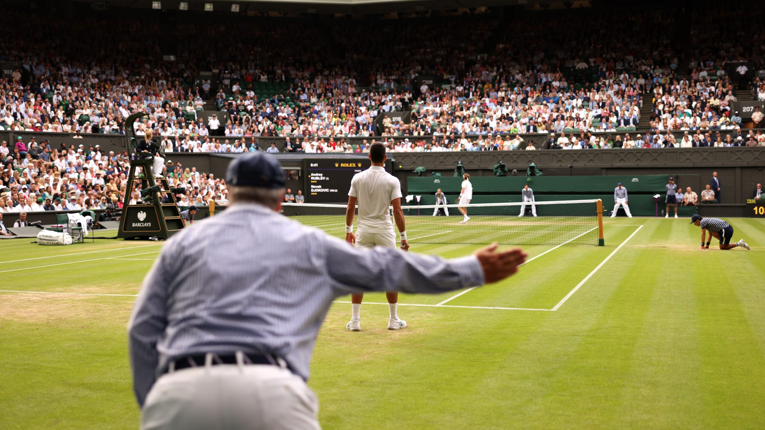 A line judge calls out during the Men's Singles Quarter Final match between Novak Djokovic of Serbia and Andrey Rublev in 2023
