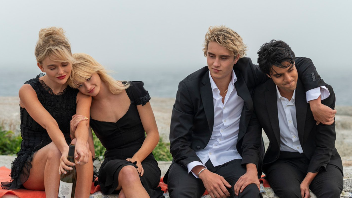 Rich and drunk young people by a beach