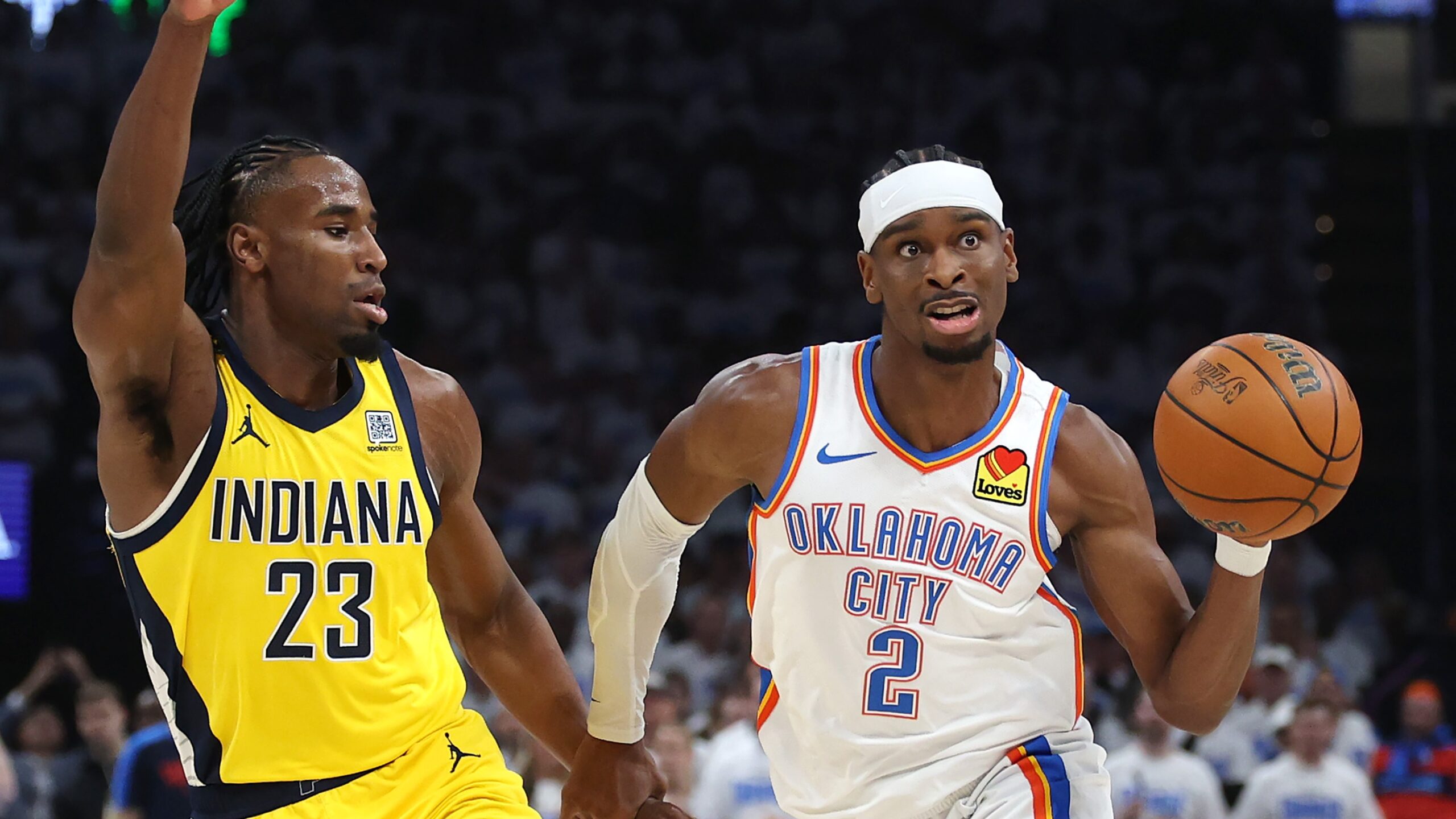 Shai Gilgeous-Alexander #2 of the Oklahoma City Thunder is defended by Aaron Nesmith #23 of the Indiana Pacers during the second quarter in Game One of the 2025 NBA Finals