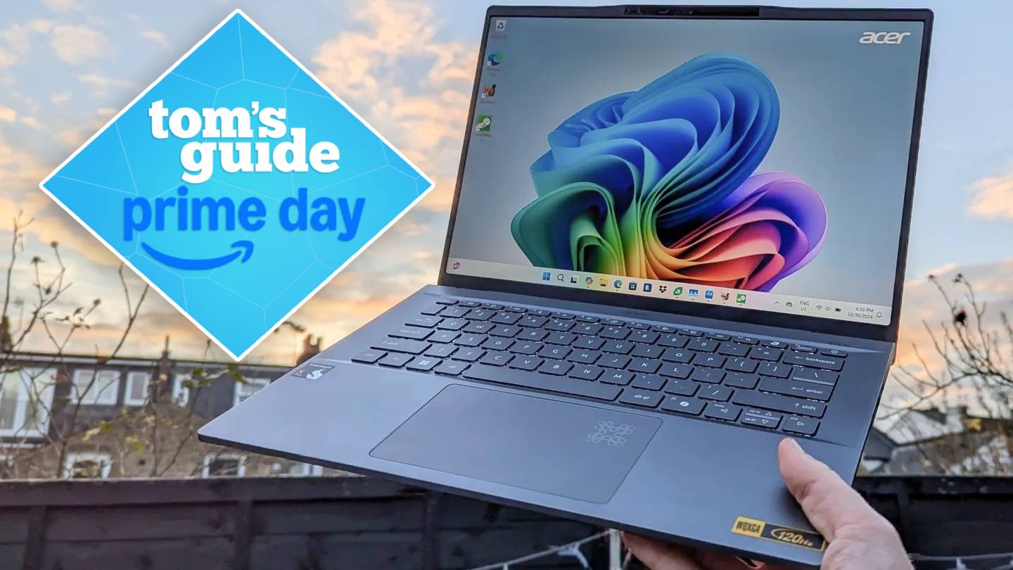Hand holding Acer Swift 14 AI against sky with Tom