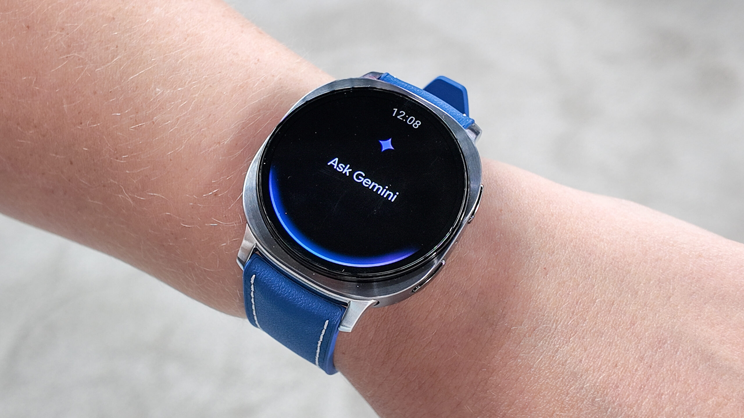 Close-up of the Samsung Galaxy Watch Ultra in the new Titanium Blue color on the writer