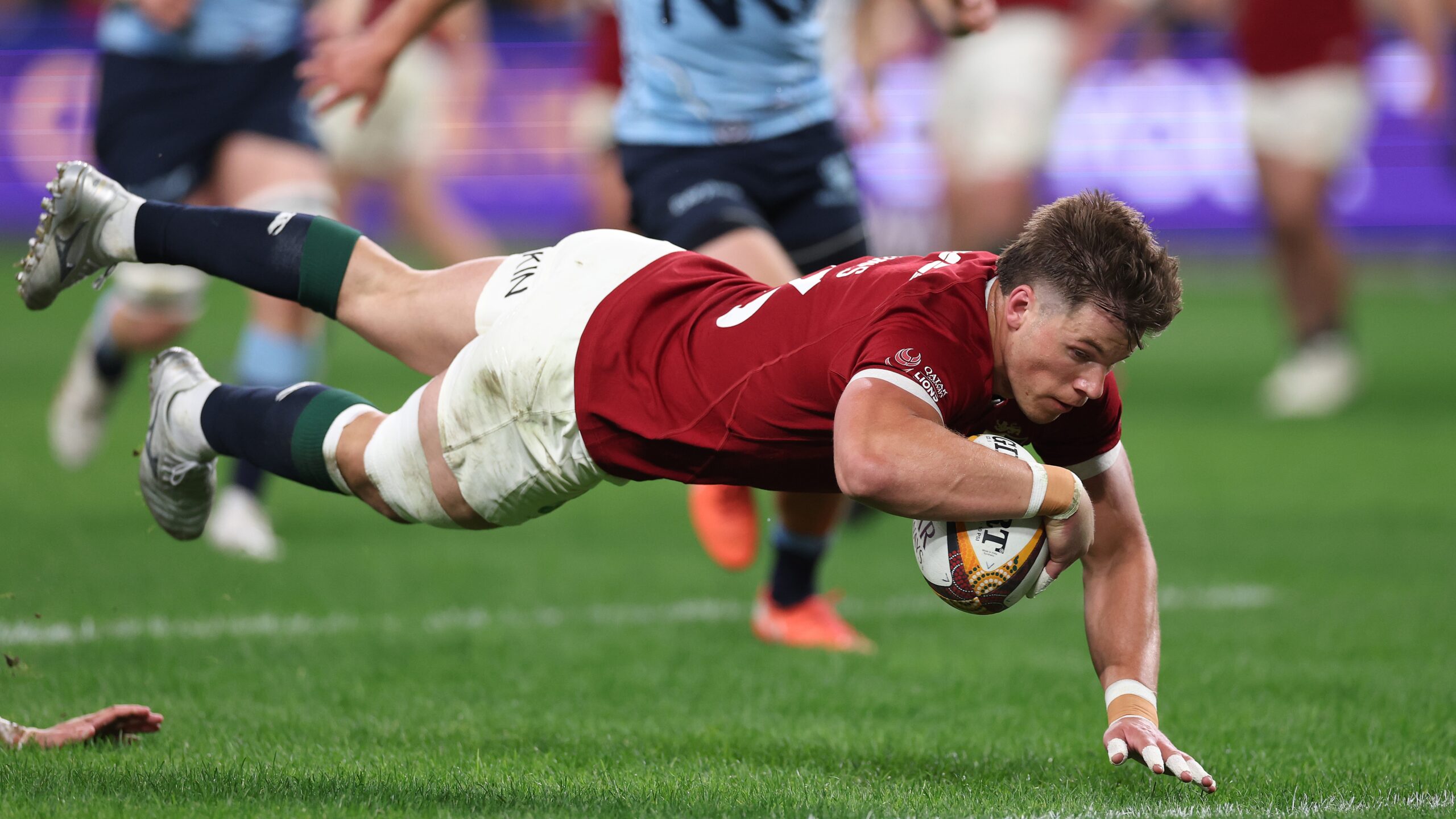 Huw Jones of the British &amp; Irish Lions dives in to score their first try during the tour match between NSW Waratahs and British &amp; Irish Lions at Allianz Stadium