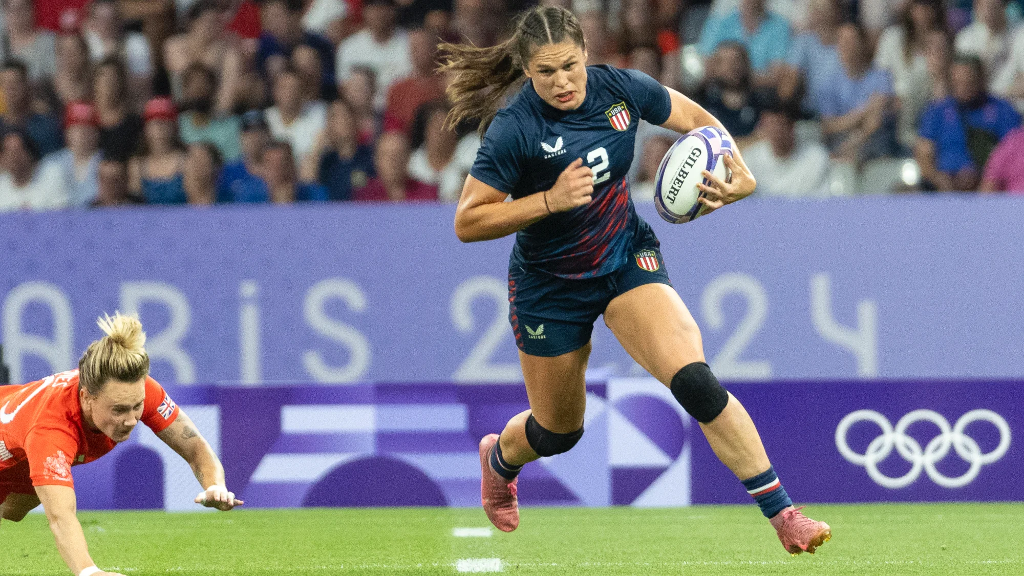 Ilona Maher #2 of the United States Women's National Team carries the ball during a women's Medal Quarter Final match between Great Britain and USA on day three of the Olympic Games Paris 2024 at Stade de France on July 29, 2024 in Paris, France.