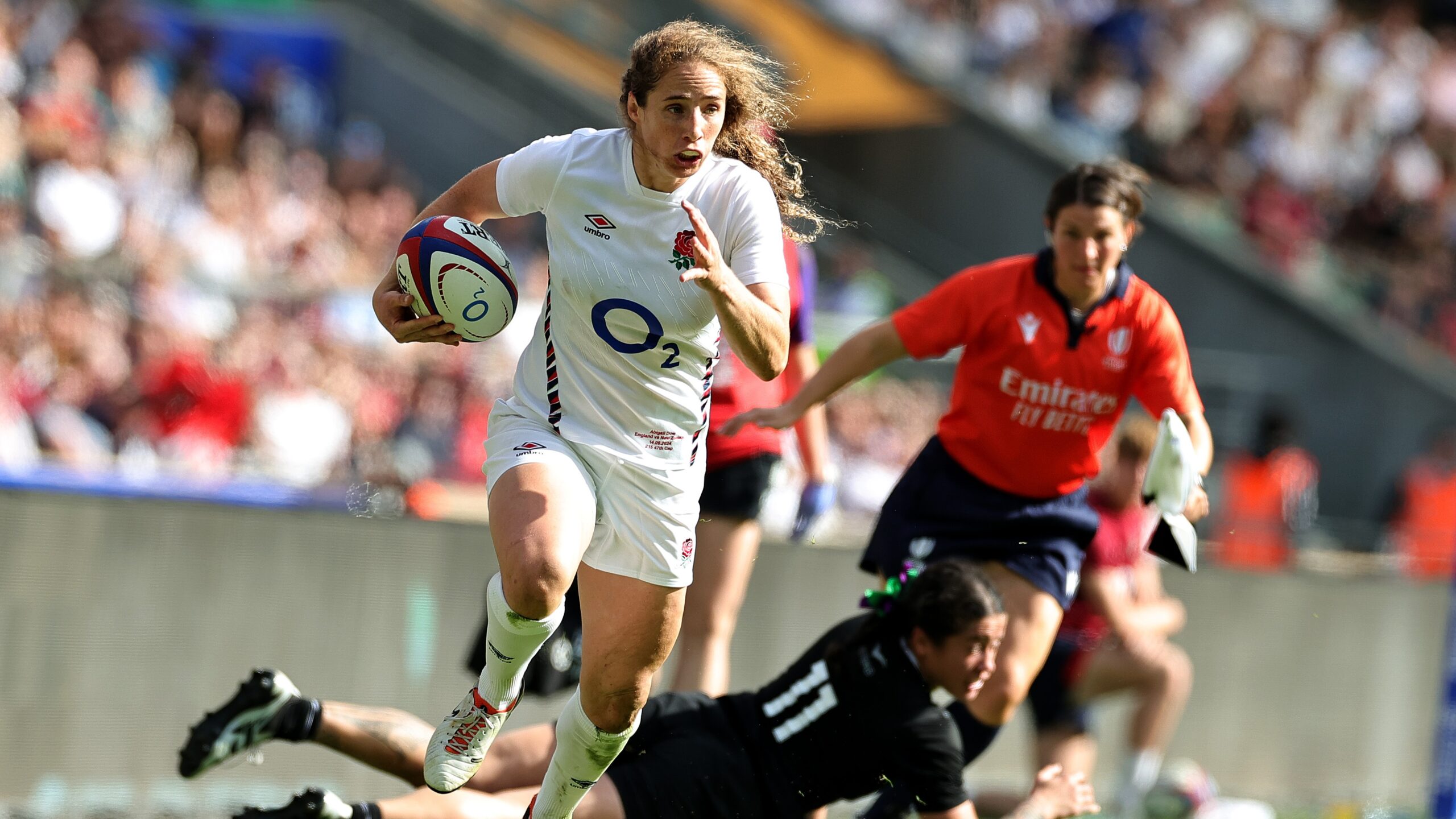 Abby Dow of England breaks clear of Katelyn Vahaakolo to score their second try during the Women's International match between England Red Roses and New Zealand Black Ferns at Allianz Twickenham Stadium on September 14, 2024 in London, England.
