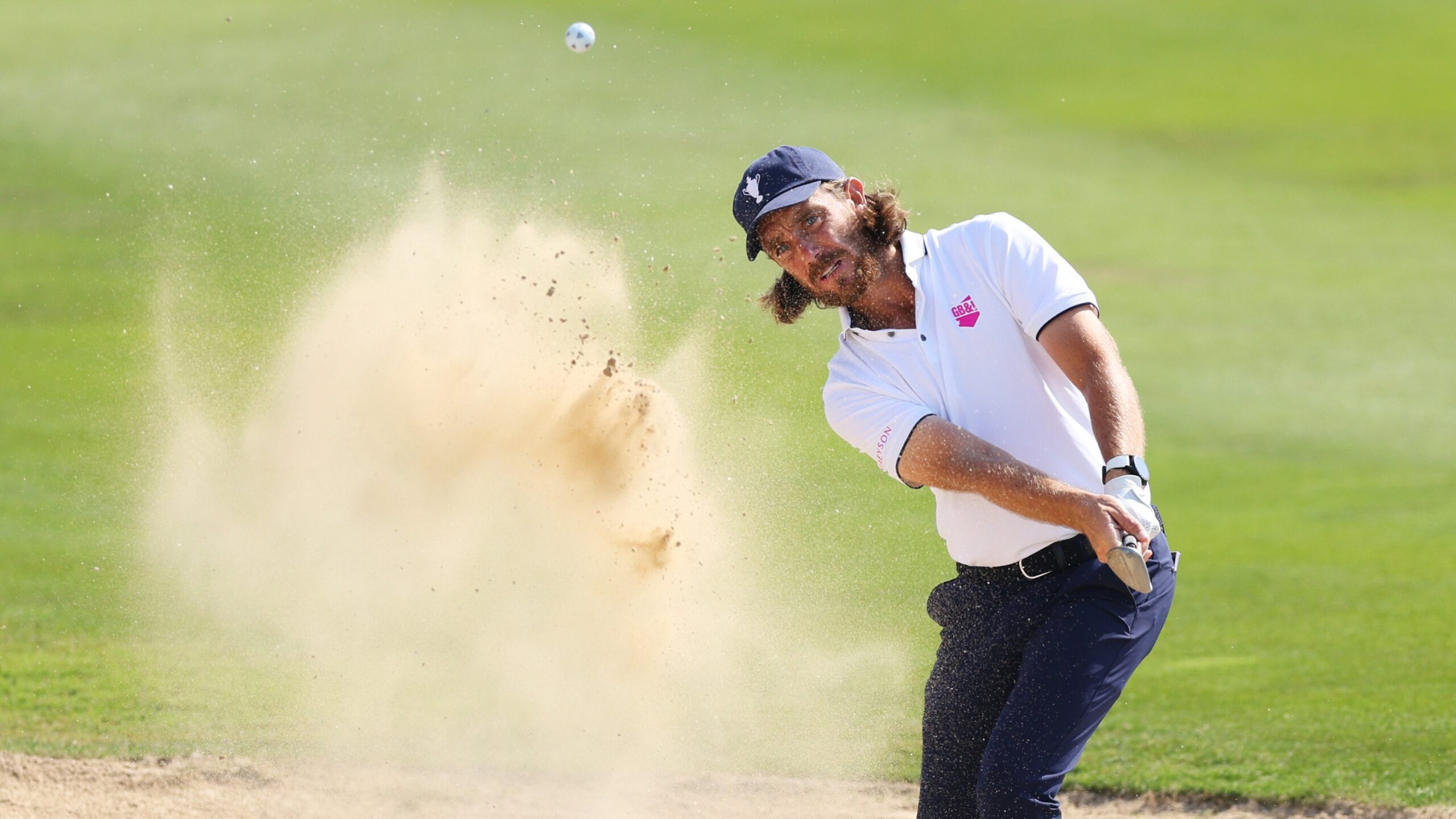 Tommy Fleetwood of Team Great Britain &amp; Ireland plays a bunker shot on the eighth hole during a practice round prior to the Team Cup at Abu Dhabi Golf Resort on January 09, 2025 in Abu Dhabi, United Arab Emirates.