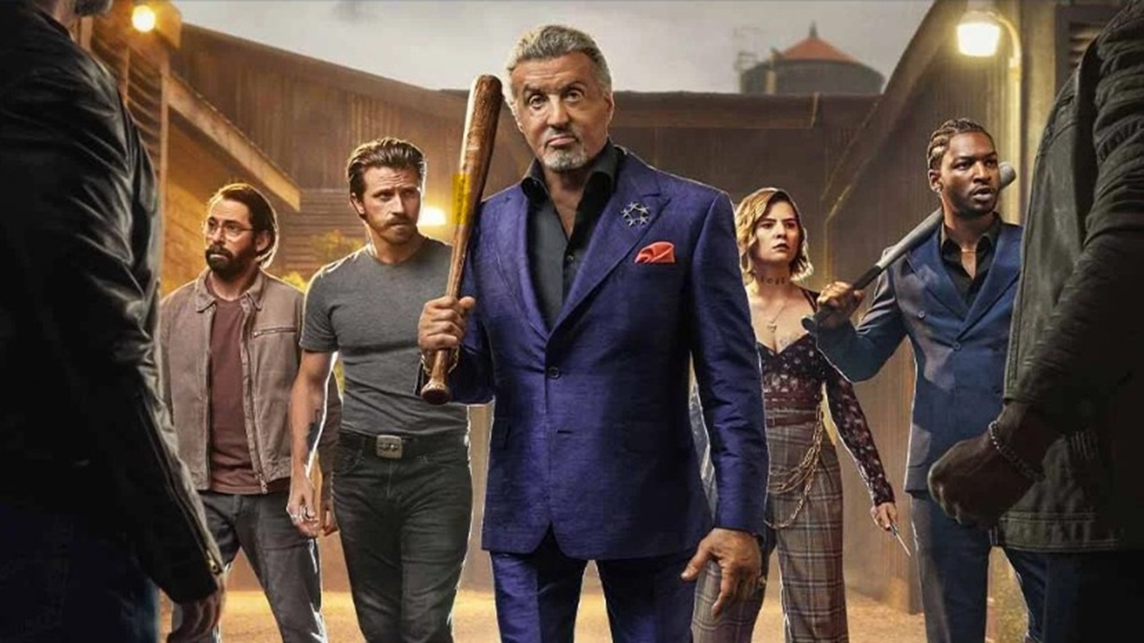 Flanked by his criminal associates, sharply dressed gangster Dwight Manfredi (Sylvester Stallone) wields a baseball ball as he faces off against two shadowy assailants in key art for "Tulsa King" season 3.