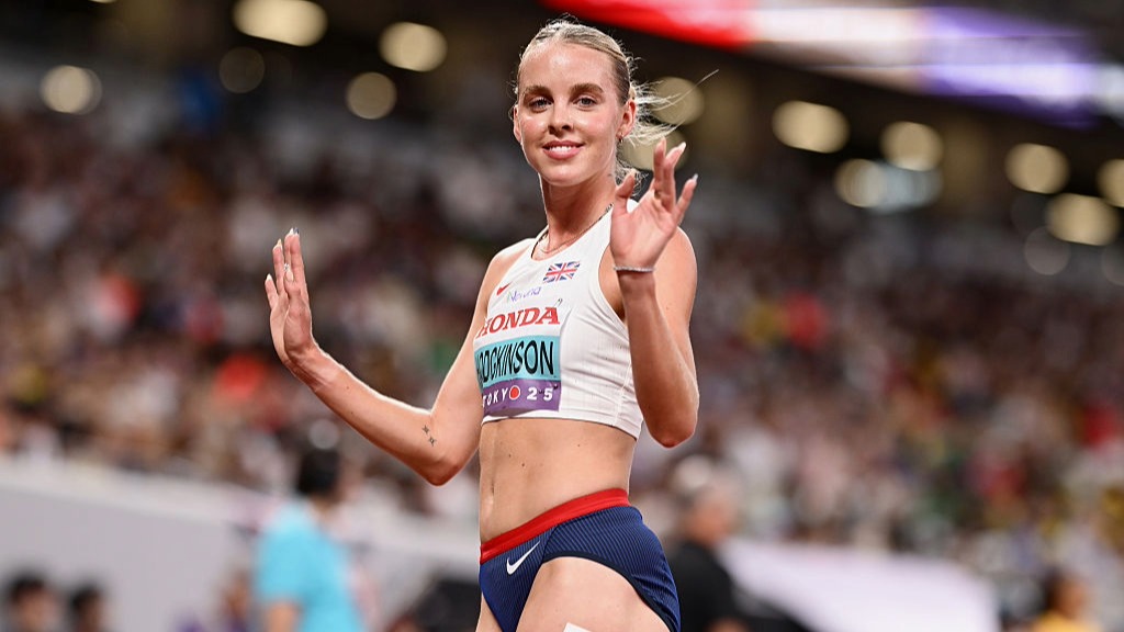 Keely Hodgkinson waves to the crowd after qualifying for the women's 800m final at the 2025 World Athletics Championships in Tokyo.
