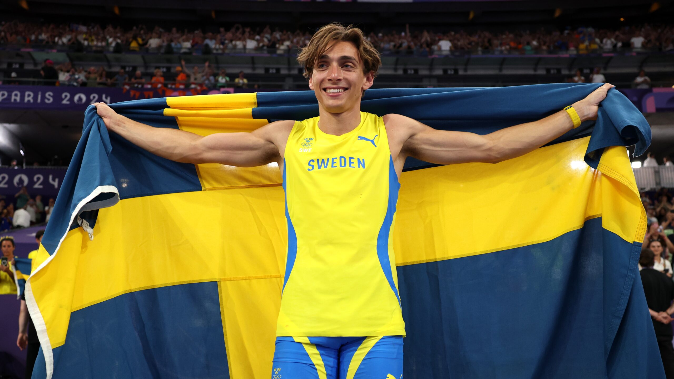 Gold medalist Armand Duplantis of Sweden celebrates after setting a new world record during the Men's Pole Vault Final on day ten of the Olympic Games Paris 2024 at Stade de France on August 05, 2024 in Paris, France.