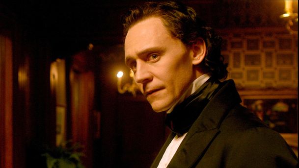 Thomas Sharpe (Tom Hiddleston) in a suit in a scene from Guillermo del Toro's "Crimson Peak"