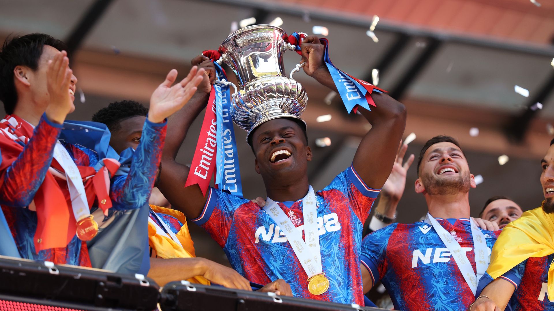 Marc Guehi of Crystal Palace celebrates with the FA Cup trophy after his team's victory in the 2025 FA Cup Final.