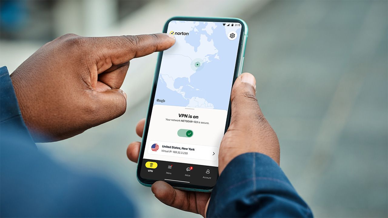 Person holding smartphone with Norton VPN app open and connected to a US server