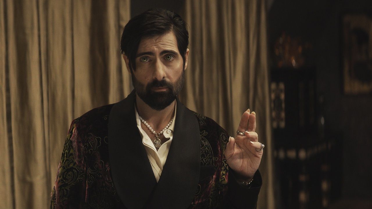 The rakish vampire Burton (Jason Schwartzman) with gleaming brown eyes stands solemnly in his Upper West Side penthouse in AMC's "Talamasca: The Secret Order".