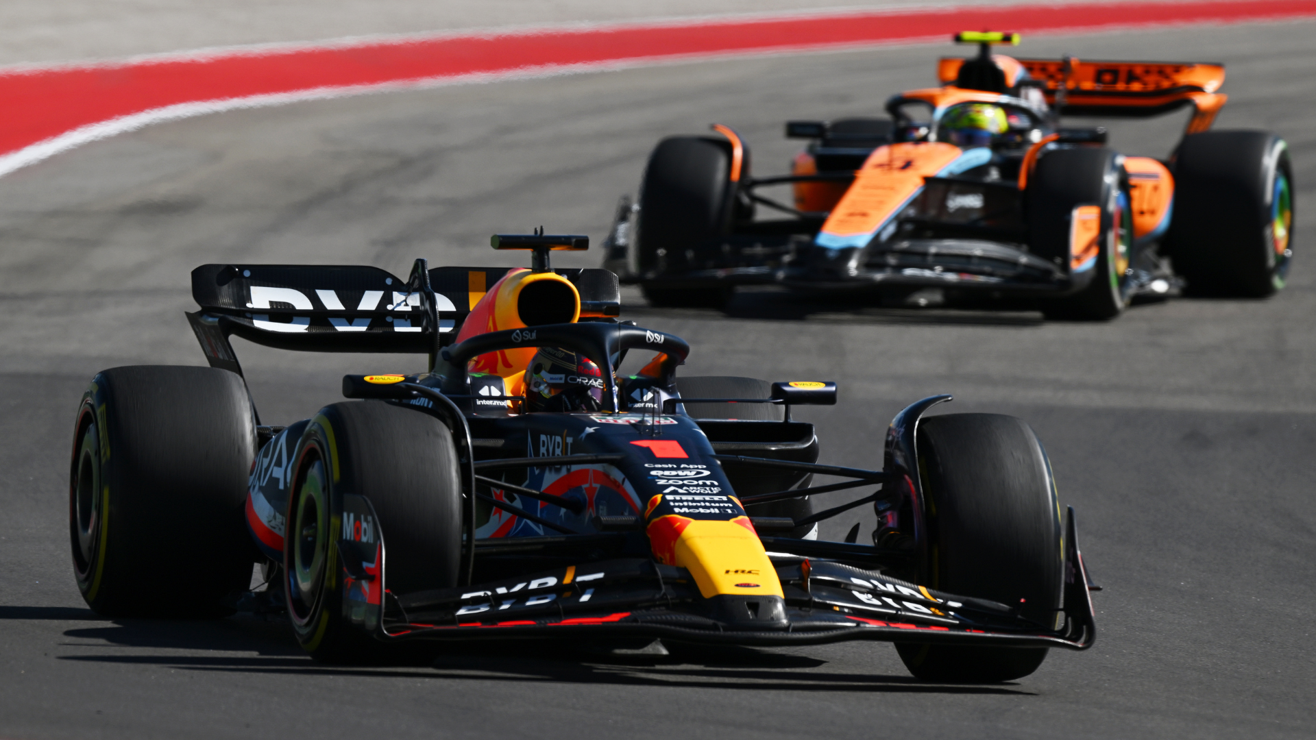 Max Verstappen of the Netherlands driving the (1) Oracle Red Bull Racing RB19 leads Lando Norris of Great Britain driving the (4) McLaren MCL60 Mercedes on track during the F1 Grand Prix of United States at Circuit of The Americas on October 22, 2023 in Austin, Texas.