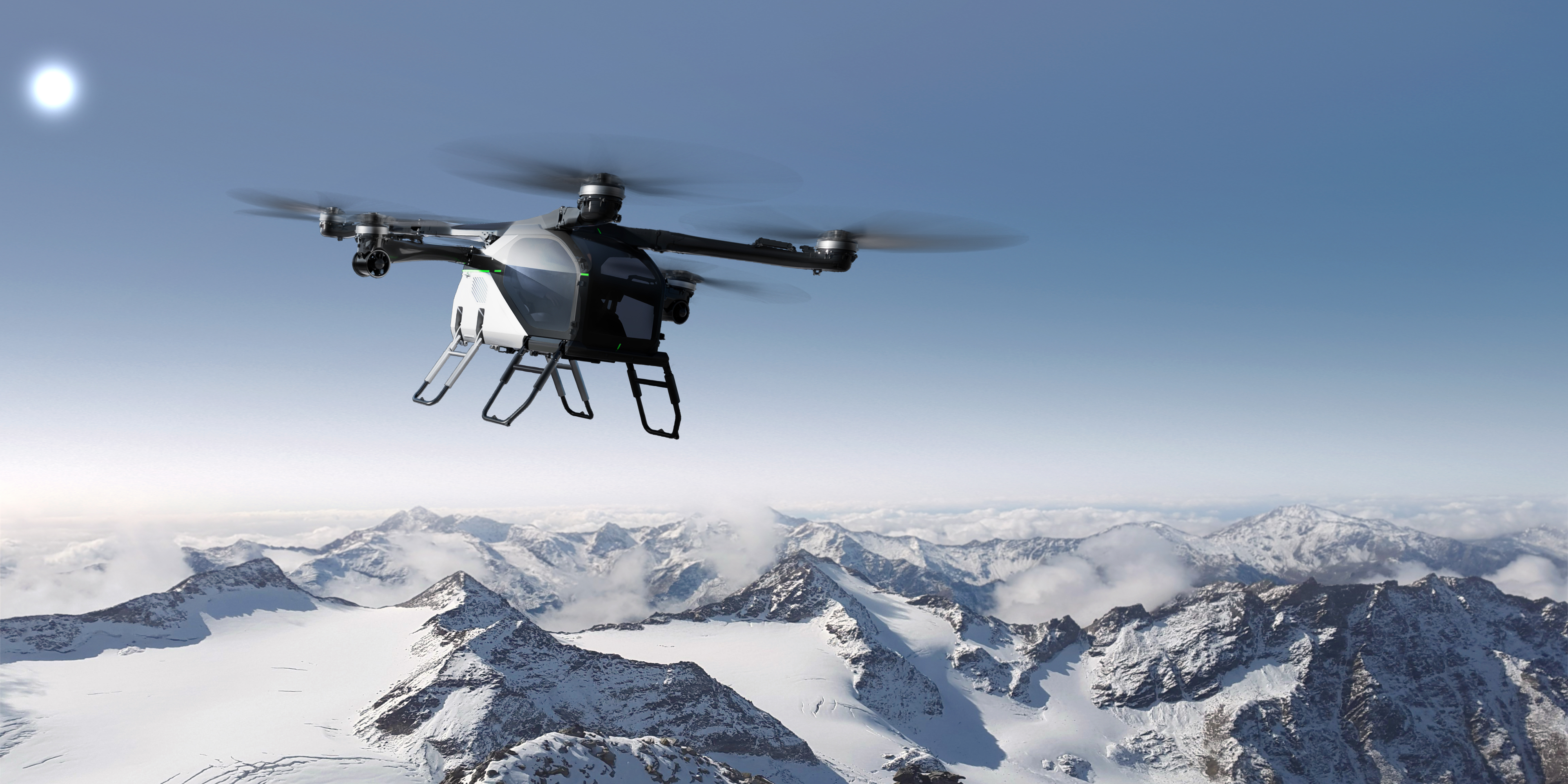 המסוק ממובילת המטוסים היבשתית של Xpeng מוצג עם הרים מושלגים ברקע.