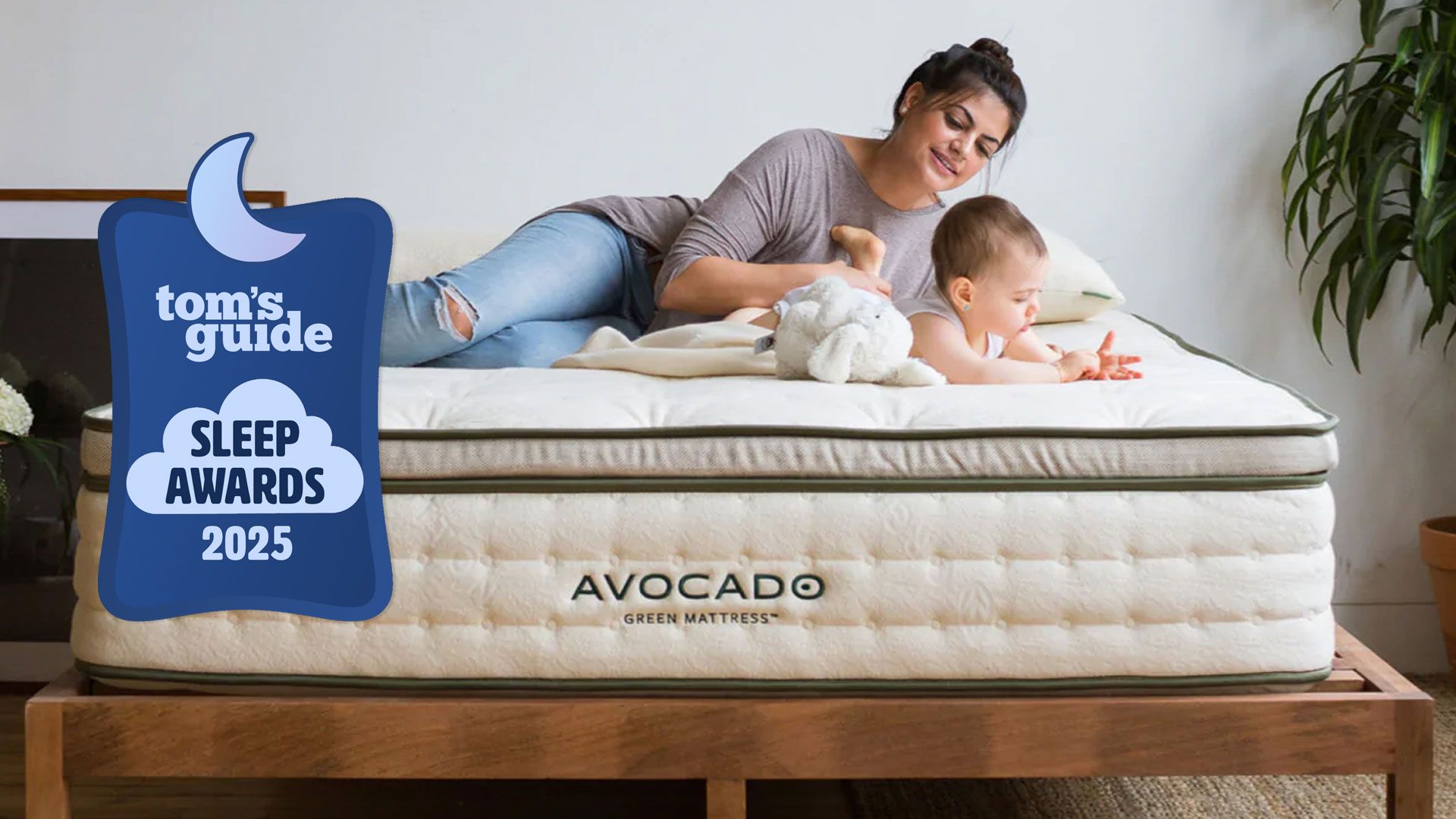 Avocado Green Mattress, featuring a woman and baby on said mattress, with a Tom's Guide Sleep Awards 2025 badge overlaid