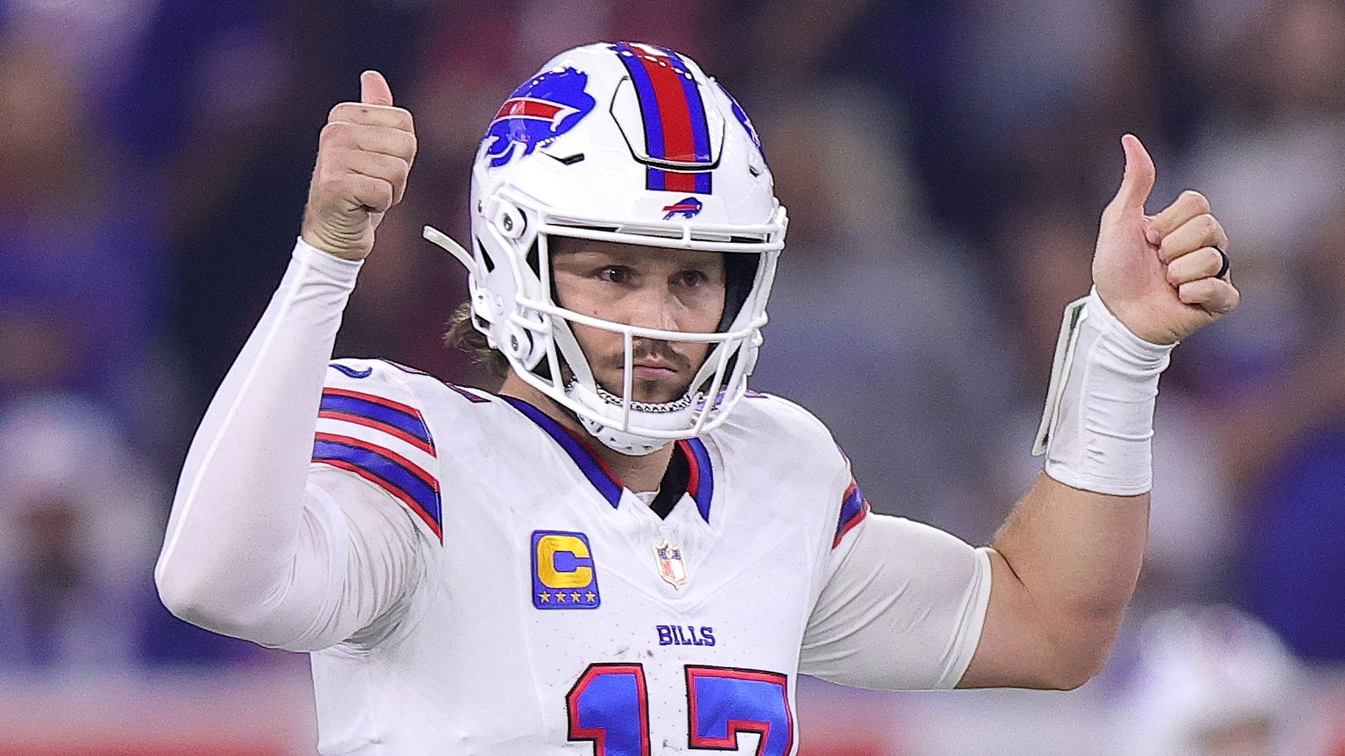 Buffalo Bills quarterback Josh Allen sticking up both thumbs against the Houston Texans
