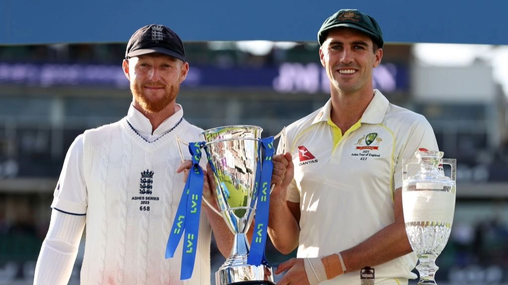 England cricket captain Ben Stokes and Pat Cummins, skipper of Australia, post with the Ashes trophy.