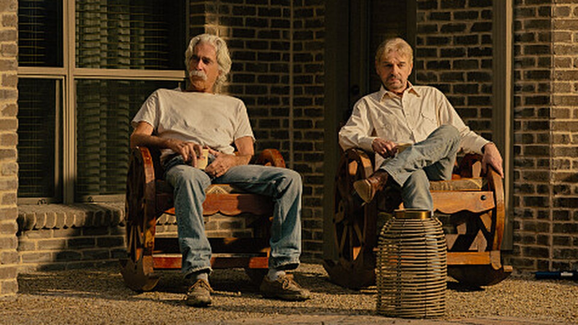T.L. (Sam Elliott) and Tommy (Billy Bob Thornton) sitting side by side in Landman season 2