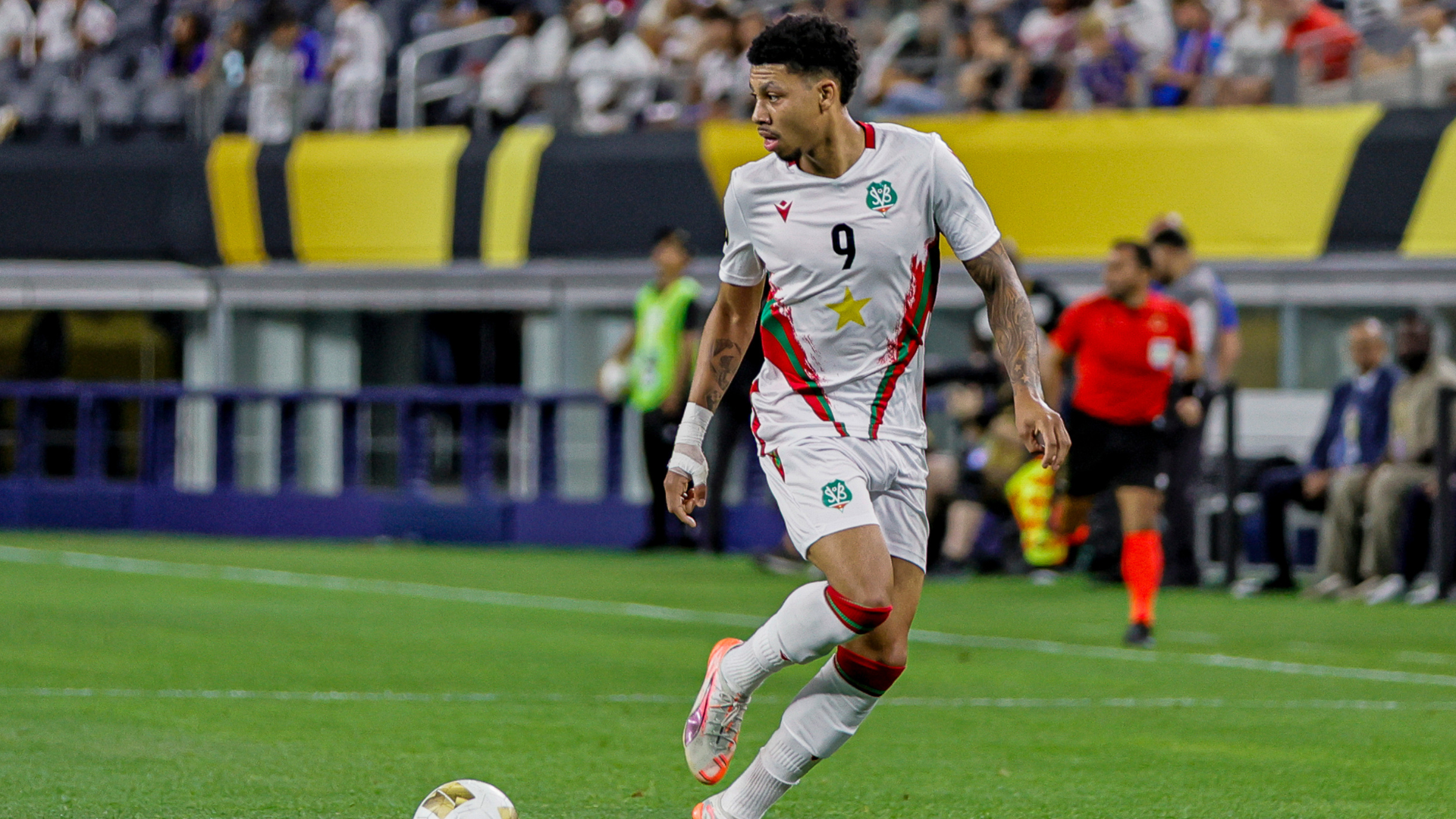 Suriname forward Richonell Margaret (9) dribbles the ball during the Concacaf Gold Cup Group stage match between the Dominican Republic and Suriname on June 22, 2025 at AT&amp;T Stadium in Arlington, Texas.