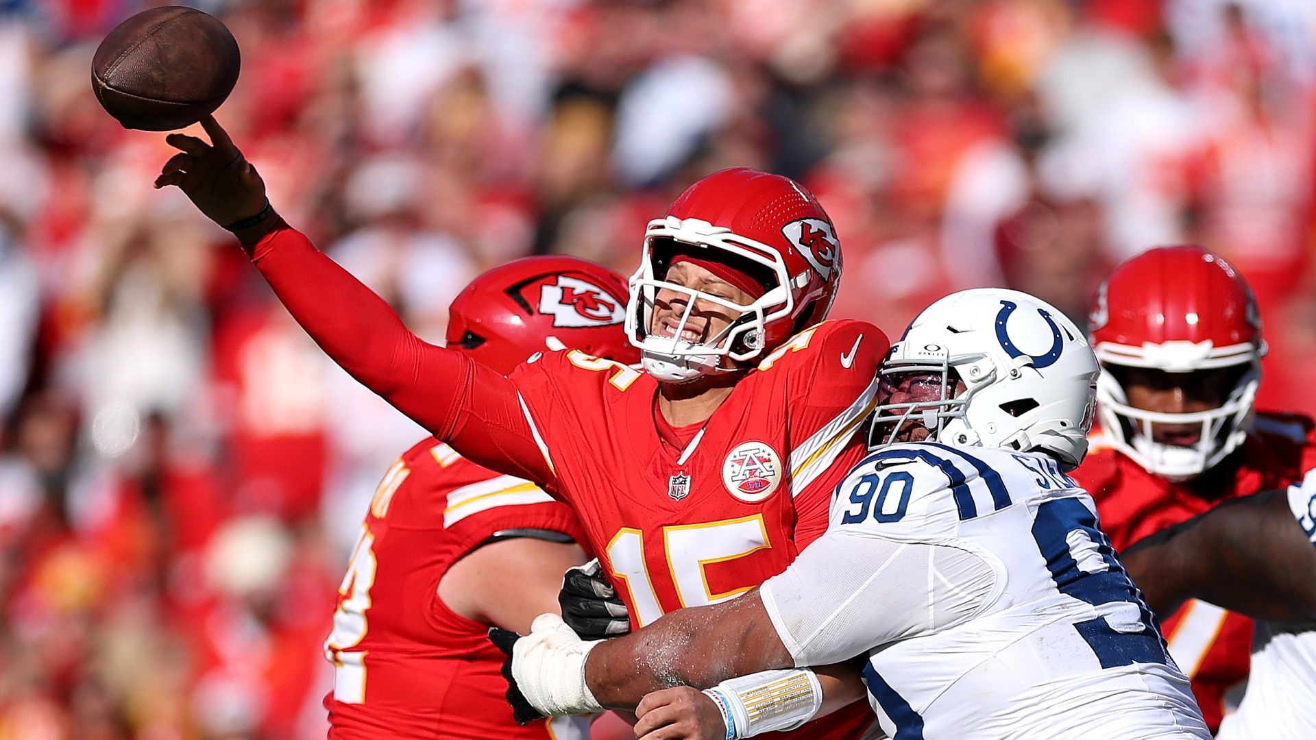 The Kansas City Chiefs' Patrick Mahomes throwing the ball under pressure from the Indianapolis Colts' Grover Stewart