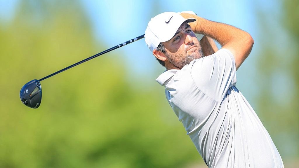 Golfer Scottie Scheffler of the U.S. plays a shot in the practice round ahead of the Hero World Challenge 2025 tournament.