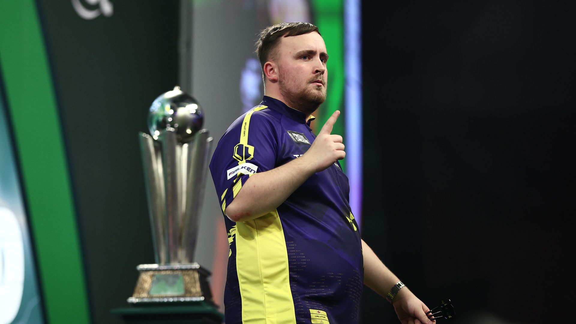 Luke Littler celebrates during a World Darts Championship match at Alexandra Palace in London.