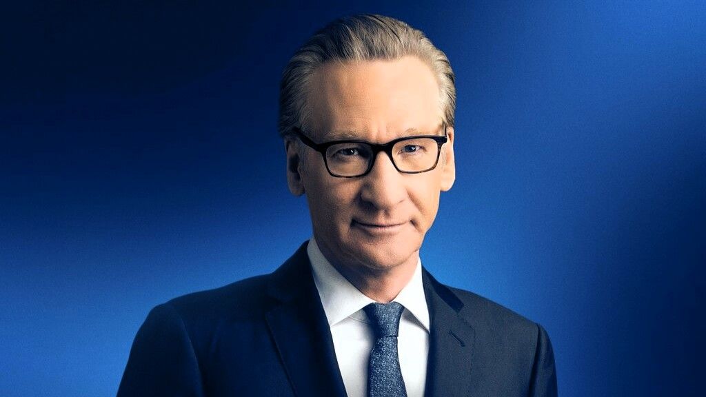 Bill Maher wearing glasses and dark suit in a portrait photo for Real Time With Bill Maher season 24