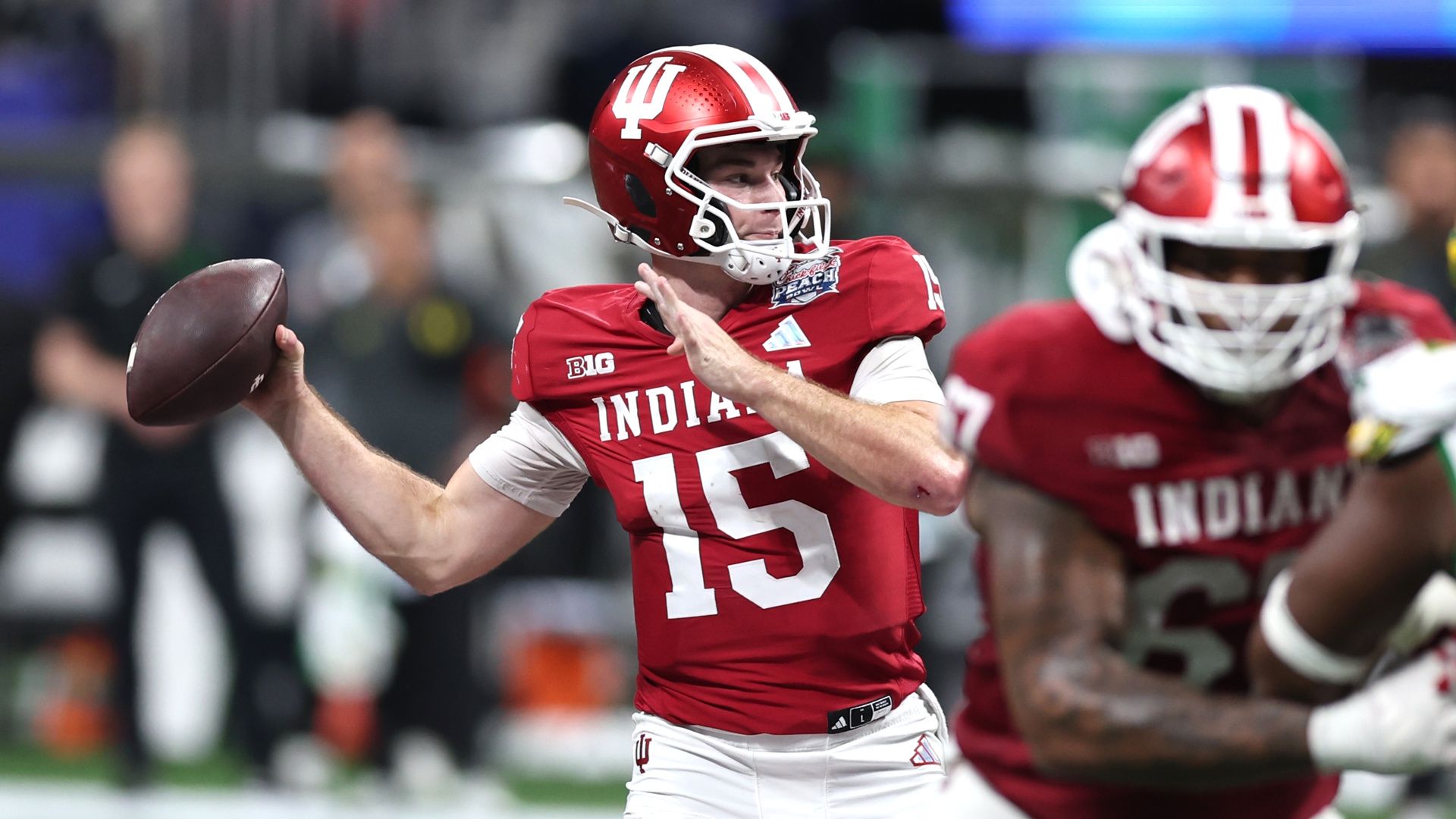 Fernando Mendoza of the Indiana Hoosiers attempts a pass during a College Football Playoff game.