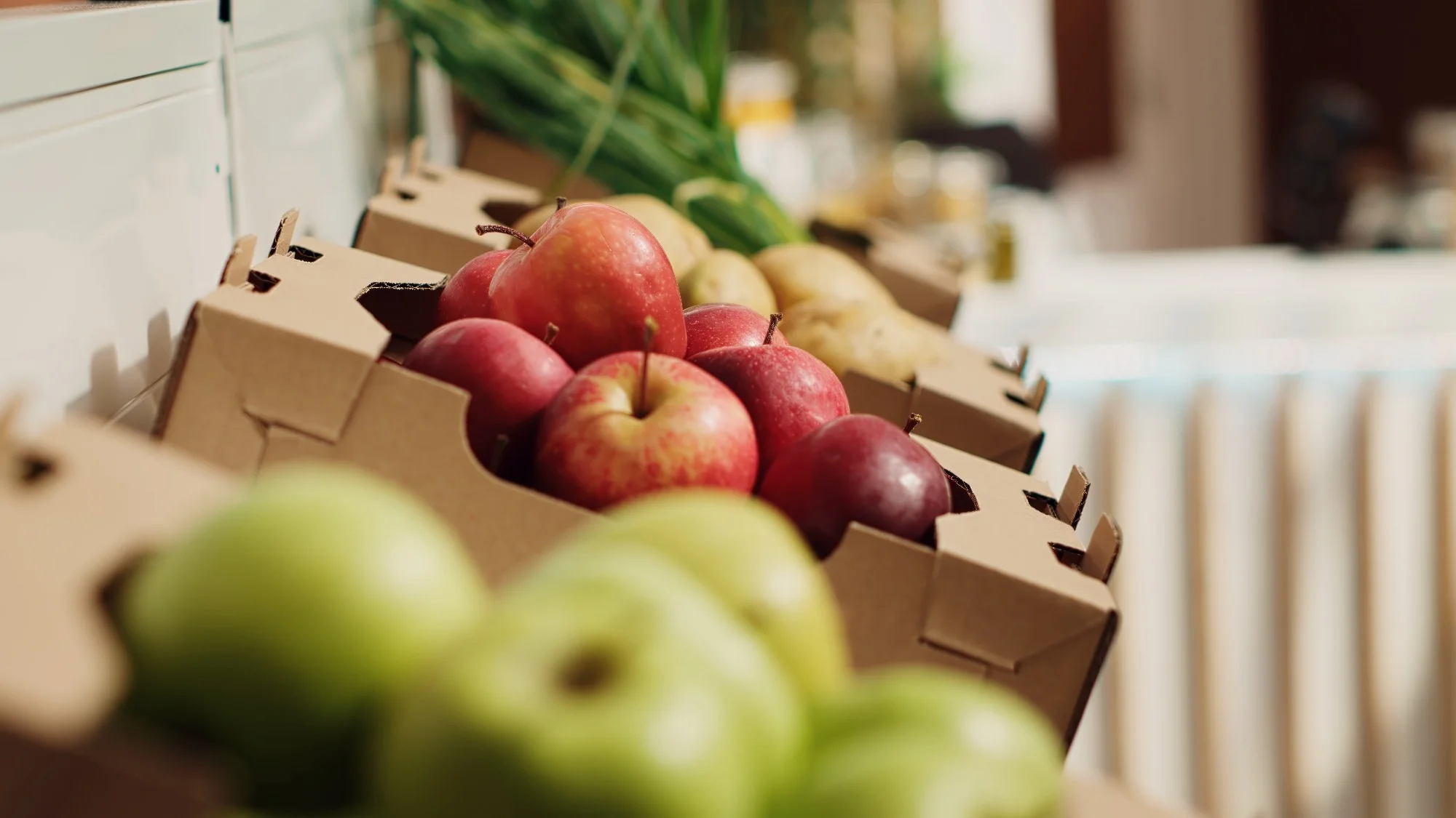 Close up zoom out shot of organic fruits and vegetables on farmers market shelves. Freshly harvested chemicals free food items in environmentally friendly zero waste supermarket