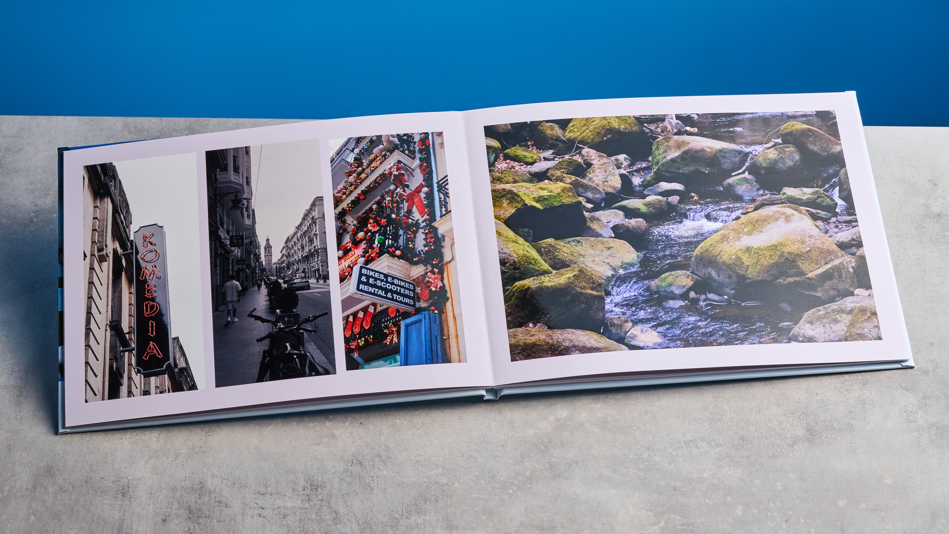 ספר צילומים של Popsa שצולם מול רקע כחול