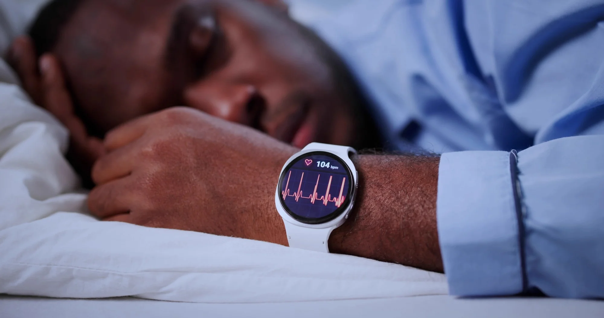 Man Asleep Using Smartwatch To Track Sleep Patterns During Night
