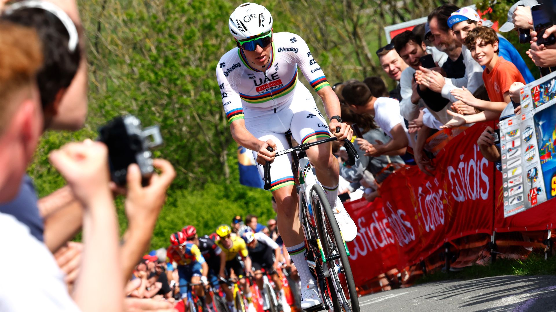Tadej Pogacar attacks climbing the Côte de la Redoute on his way to winning the Liege - Bastogne - Liege in 2025.
