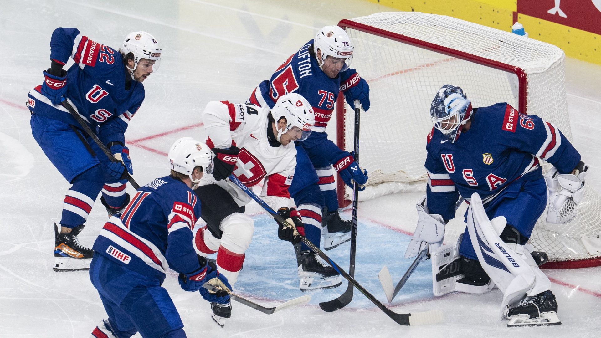 Switzerland's Pius Suter scores against USA's Joseph Woll at the 2026 IIHF World Championship