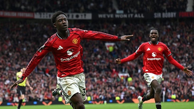 Kobbie Mainoo of Manchester United celebrates after scoring his team's third goal during the Premier League match between Manchester United and Liverpool at Old Trafford.