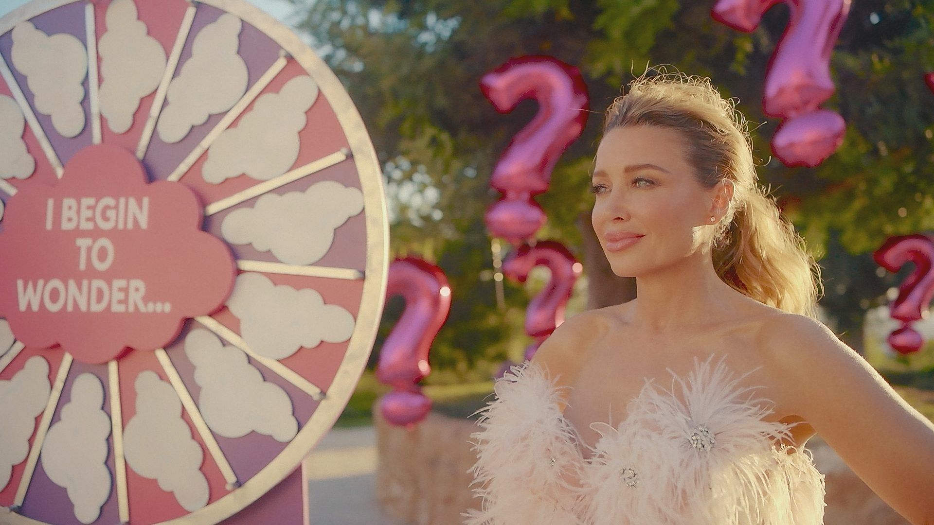 Dannii Minogue in white dress in Italy, the host of "I Kissed A Girl" season 2 streaming on BBC iPlayer