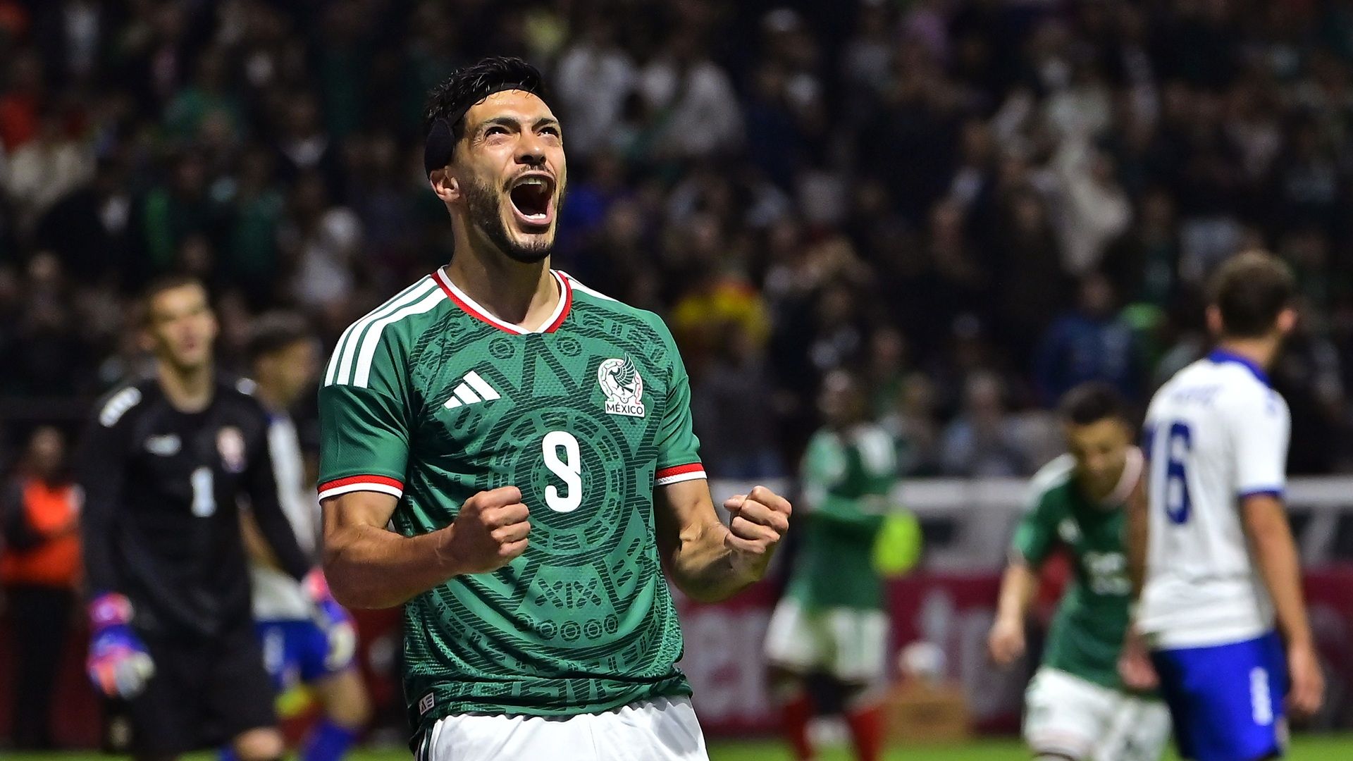 Raul Jimenez of Mexico clenches his fists while celebrating scoring his team's goal during a friendly match with Serbia at Nemesio Diez Stadium