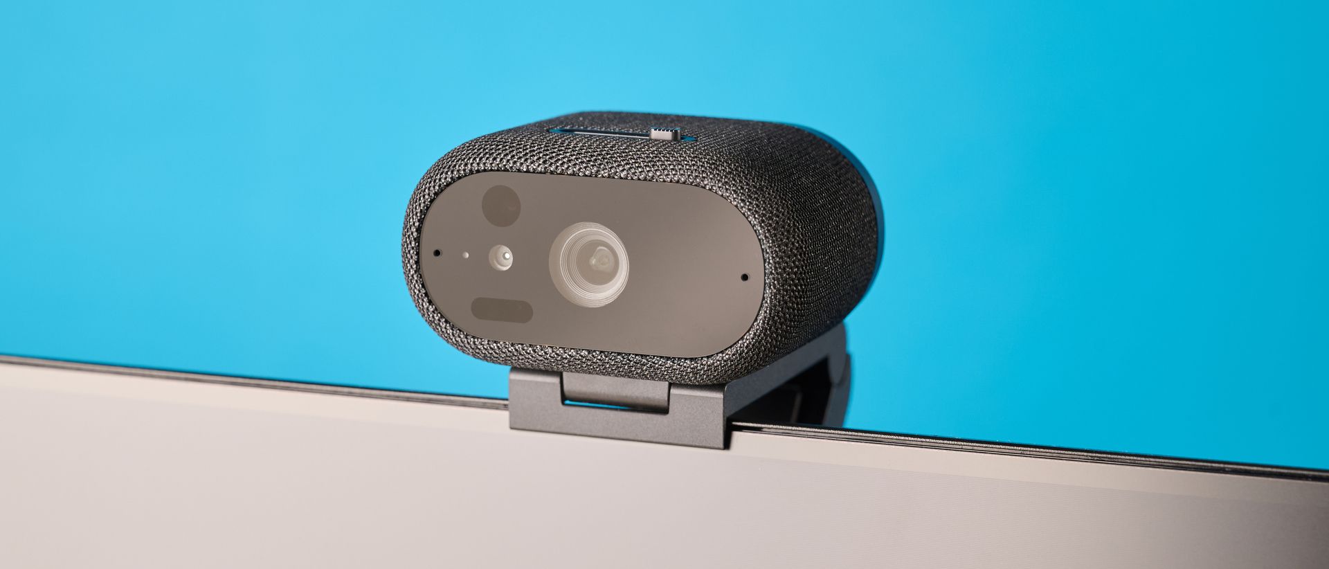 Dell Pro 7 Webcam photographed in front of a blue background
