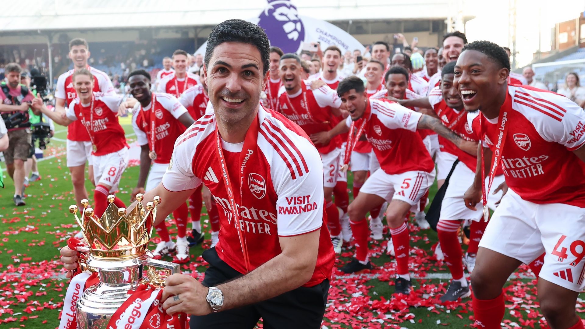 Mikel Arteta and the Arsenal team celebrate winning the Premier League