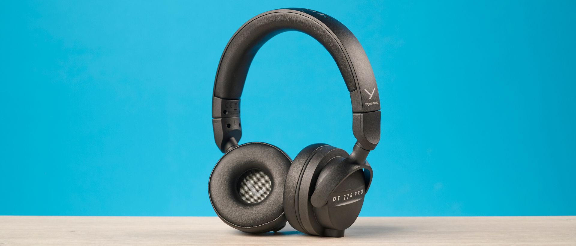 Beyerdynamic DT 275 Pro photographed in front of a blue background